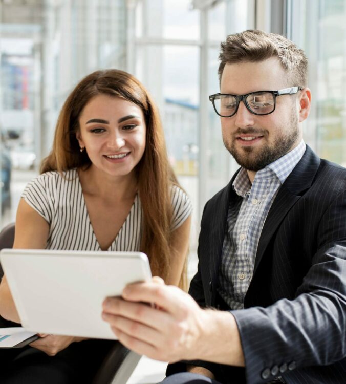 business professionals reviewing presentation before meeting